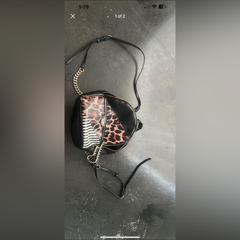This is a Victoria secret mini back pack and its black with some gold on it
